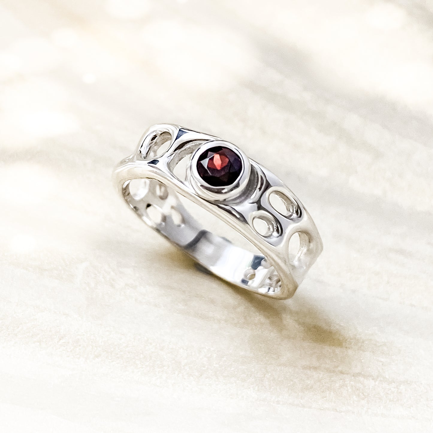 Sterling Silver Infinity Ring with Garnet