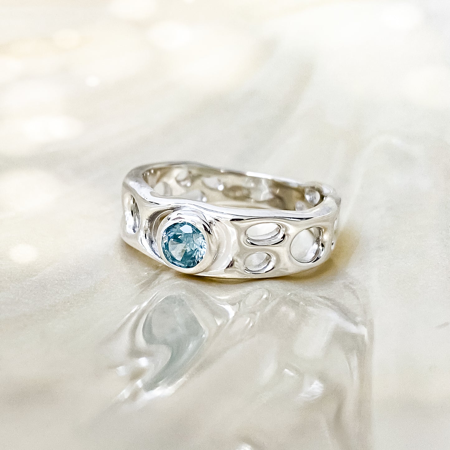 Sterling Silver Infinity Ring with Blue Topaz