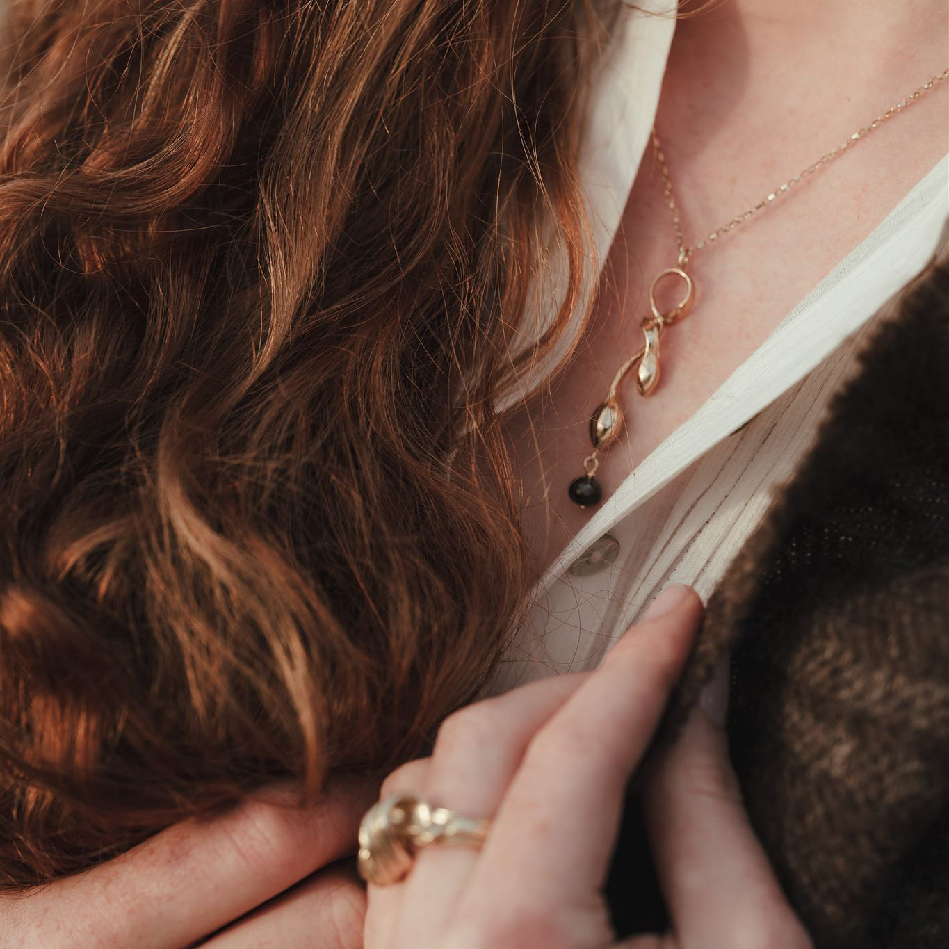 Gold Seaweed Pendant Necklace with Black Diamond