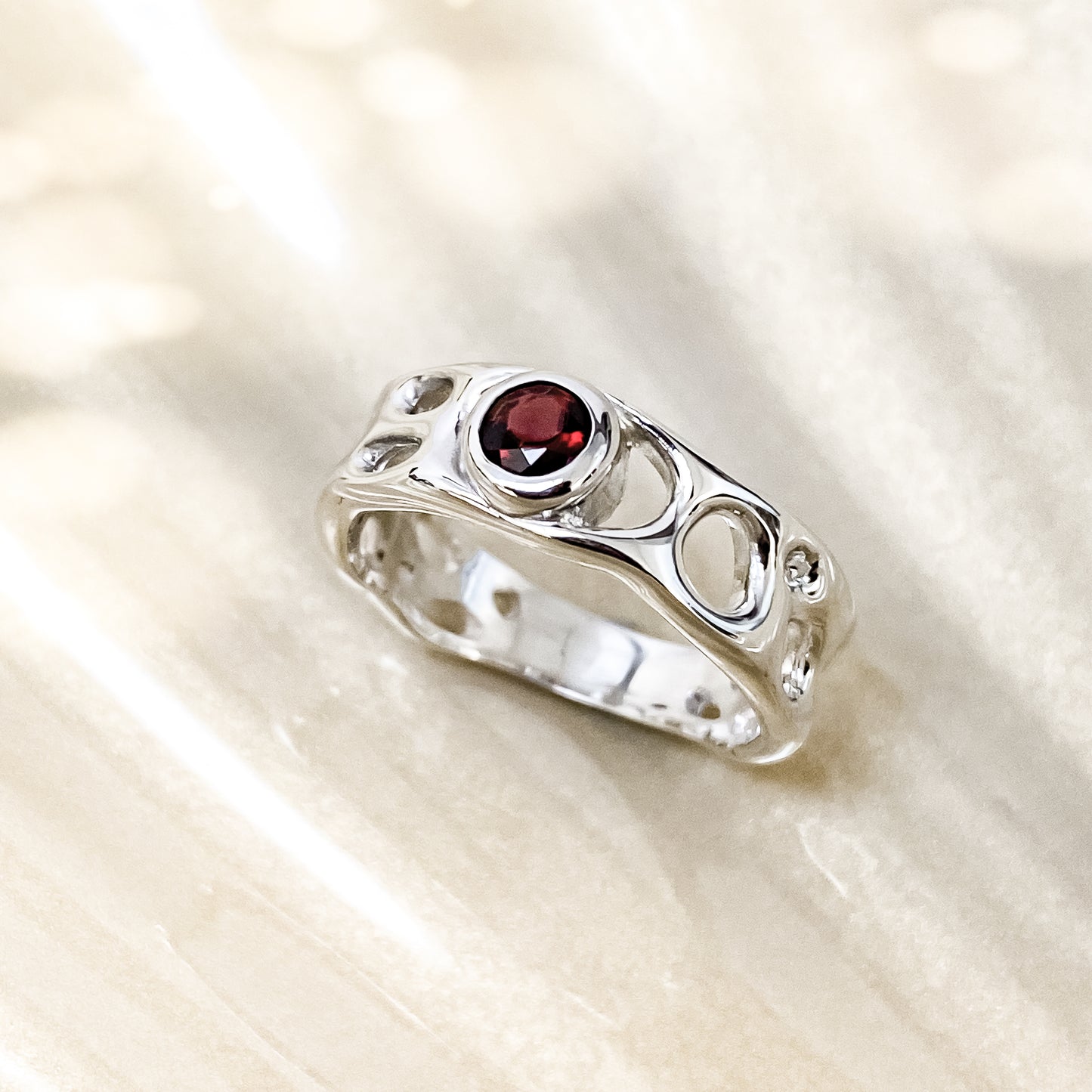 Sterling Silver Infinity Ring with Garnet