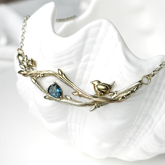One of a Kind White and Yellow Gold Oak Twig and Wren Necklace, with Diamond and London Blue Topaz