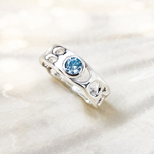 Sterling Silver Infinity Ring with Blue Topaz