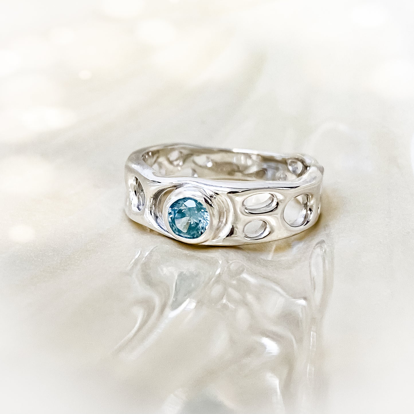 Sterling Silver Infinity Ring with Blue Topaz