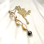 Gold Seaweed Pendant Necklace with Black Diamond