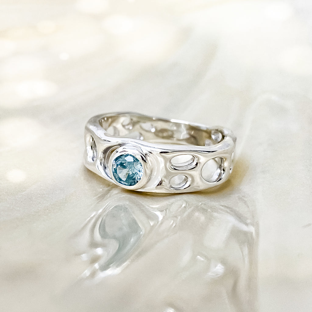 Sterling Silver Infinity Ring with Blue Topaz