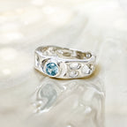 Sterling Silver Infinity Ring with Blue Topaz