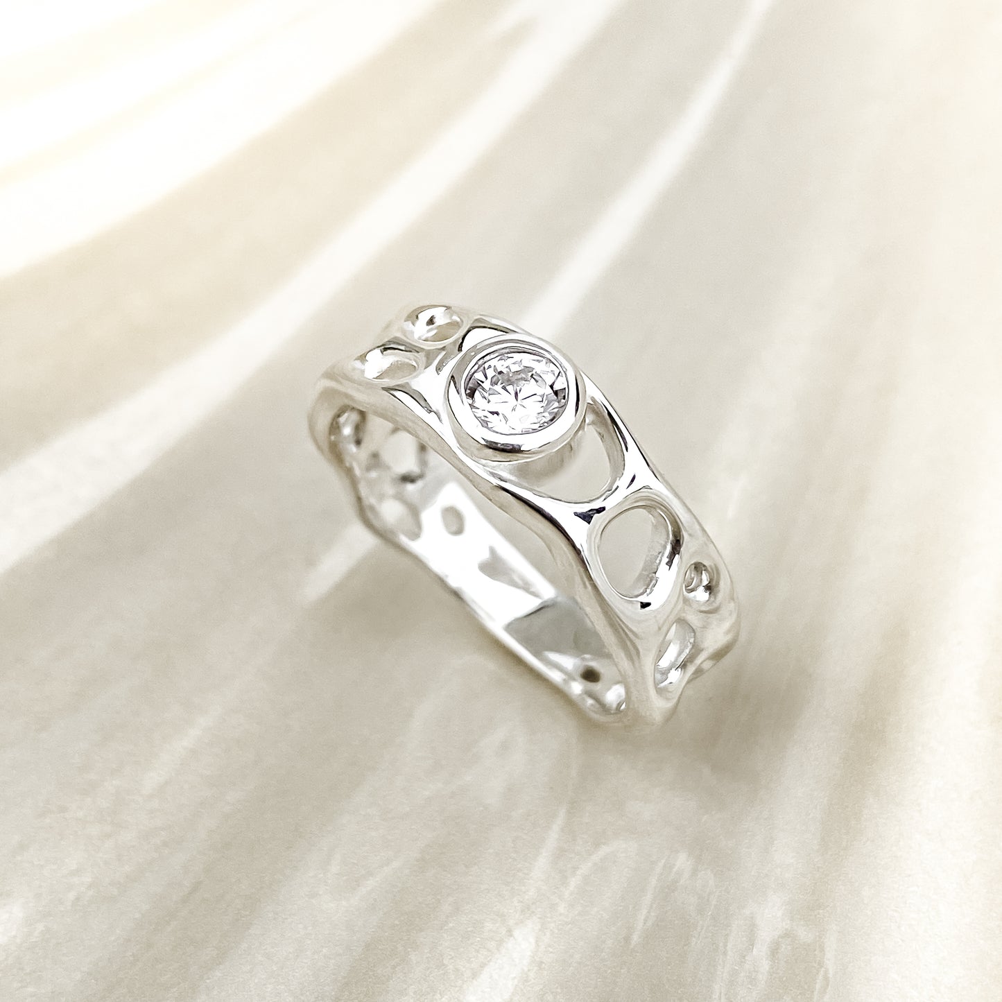 Sterling Silver Infinity Ring with White Topaz