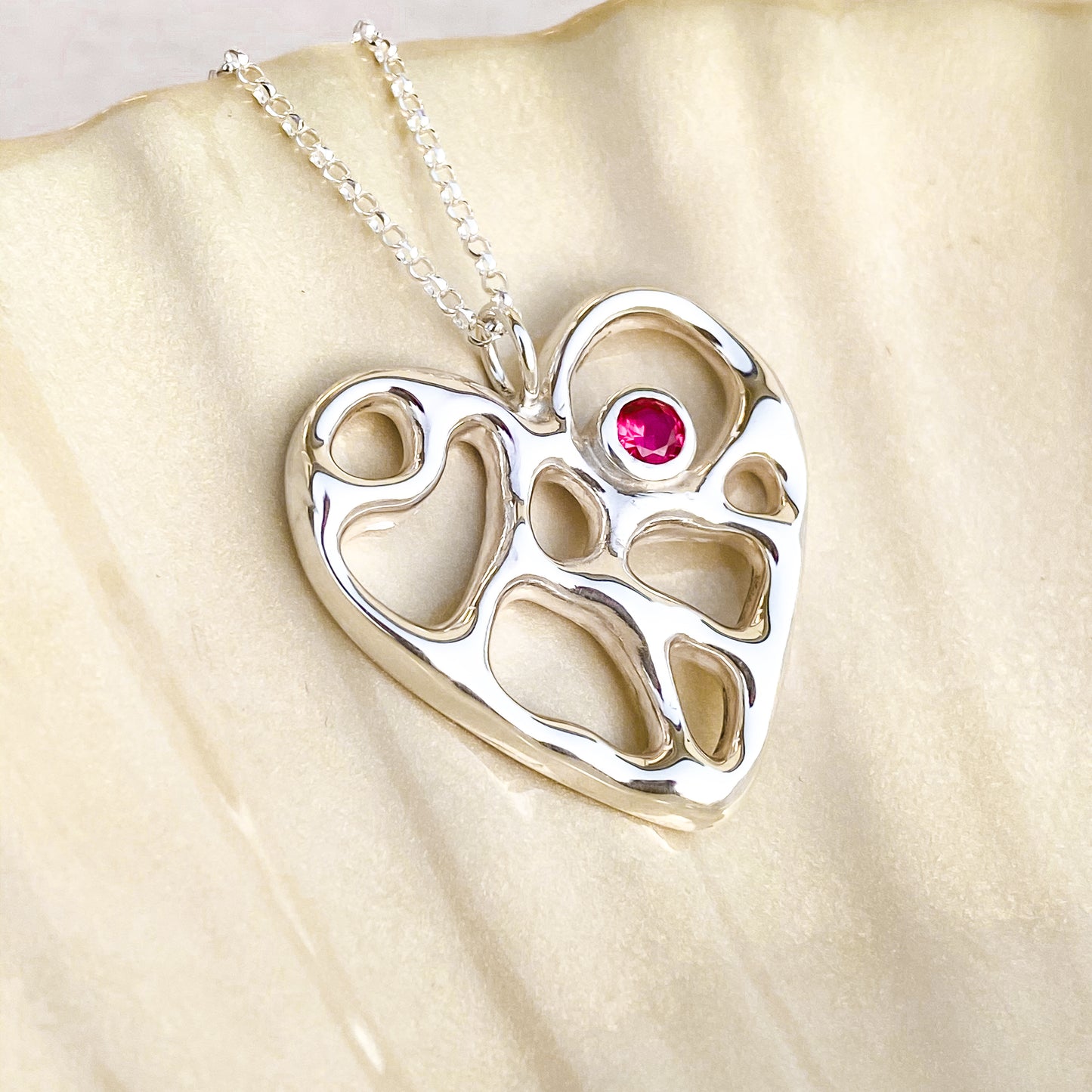 Silver Infinity Heart Necklace with Ruby Corundum