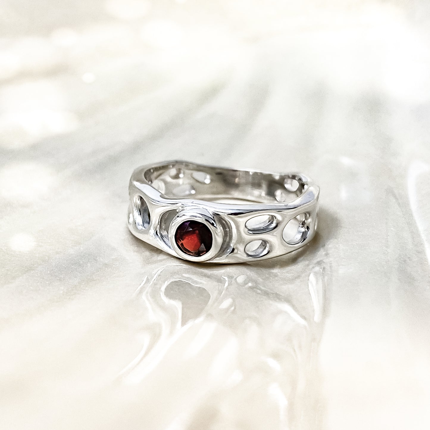 Sterling Silver Infinity Ring with Garnet