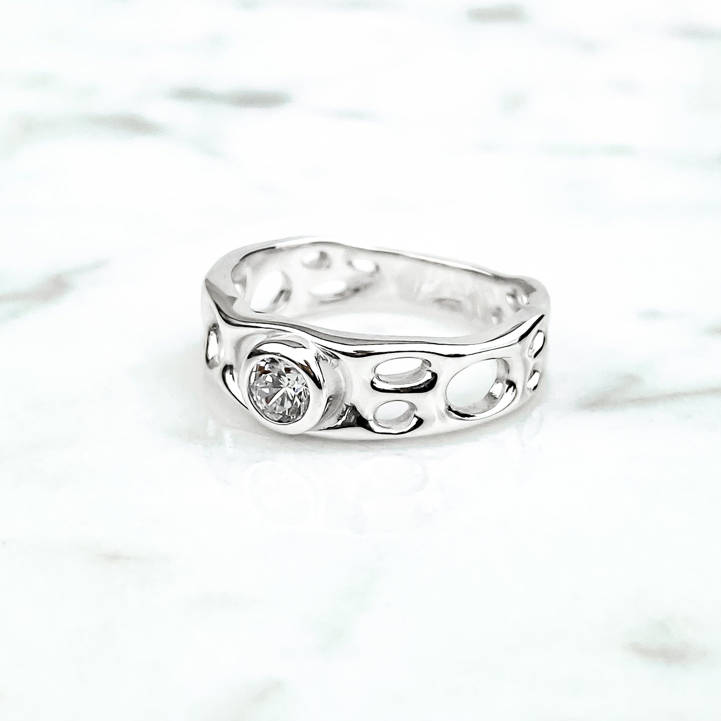 Sterling Silver Infinity Ring with White Topaz