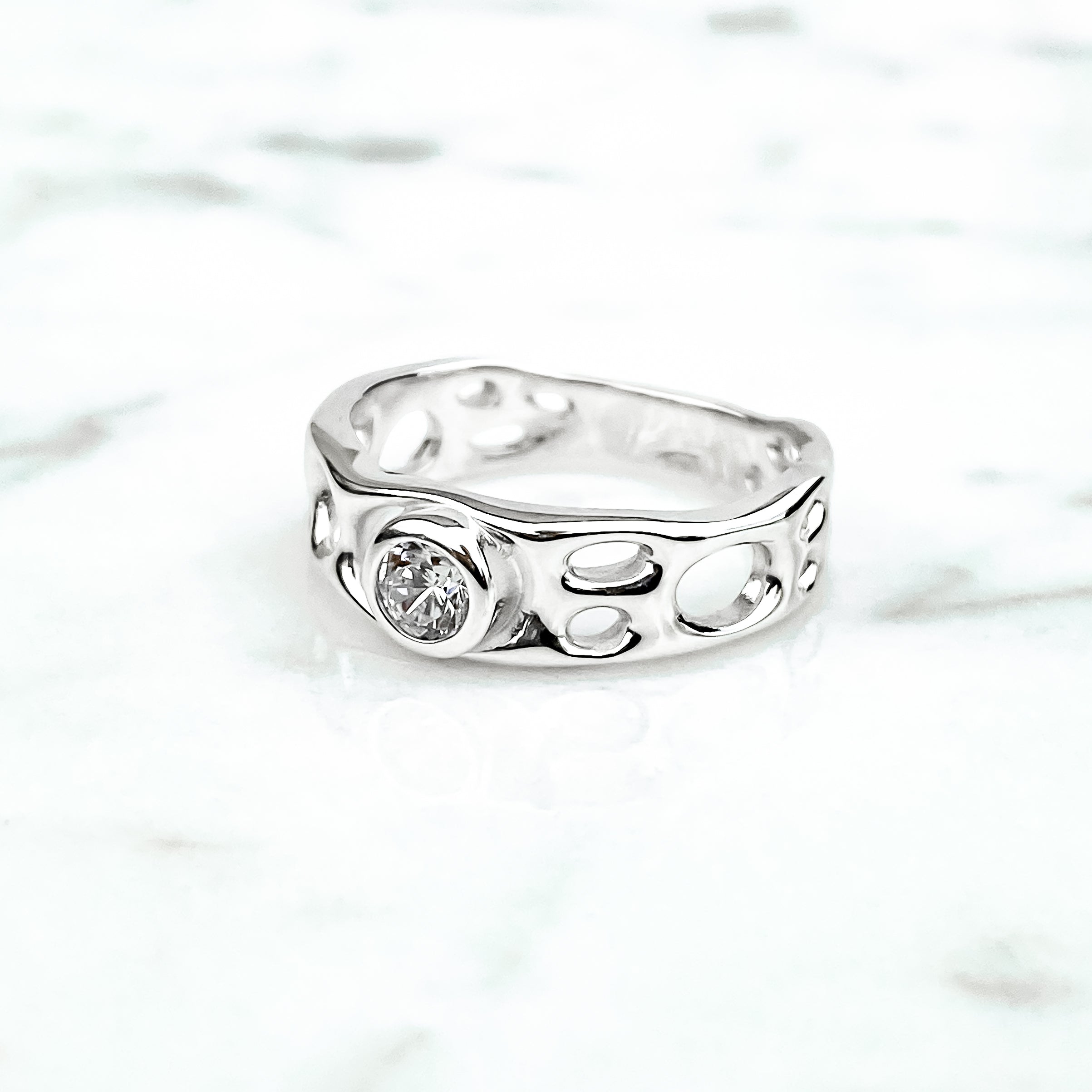 Sterling Silver Infinity Ring with White Topaz