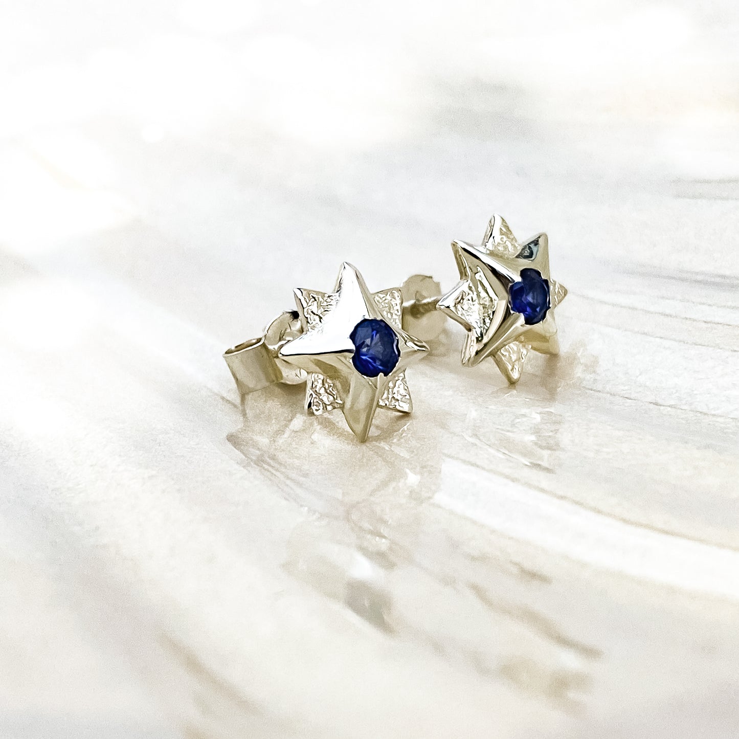 White Gold North Star Stud Earrings with Sapphire