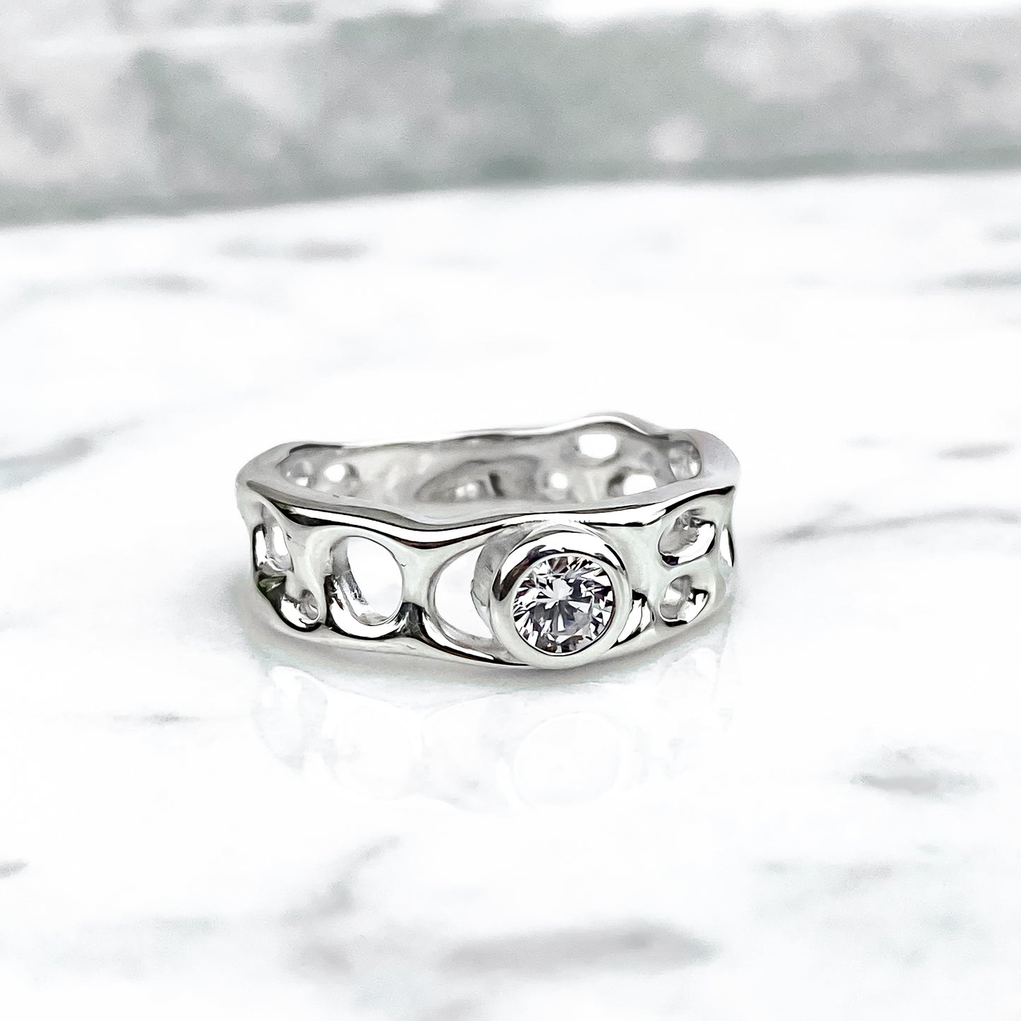 Sterling Silver Infinity Ring with White Topaz