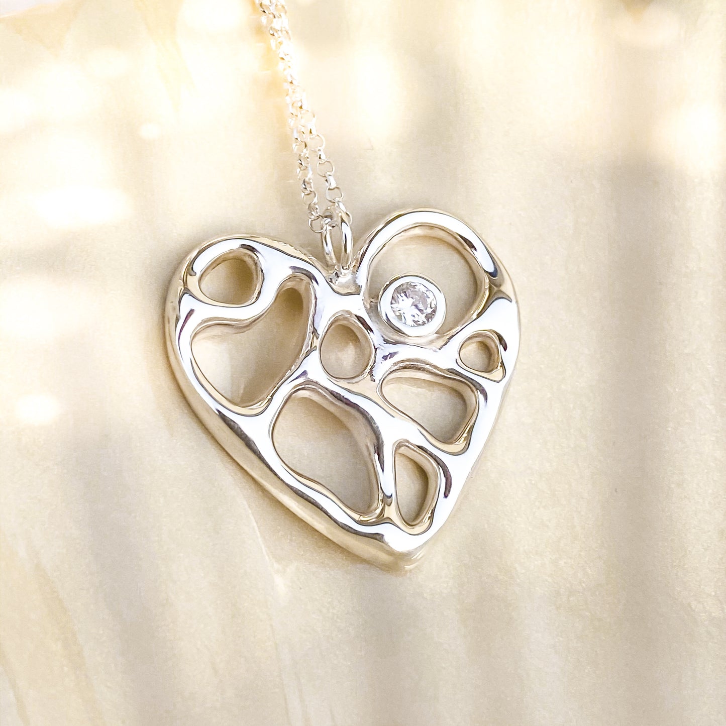 Silver Infinity Heart Necklace with White Topaz