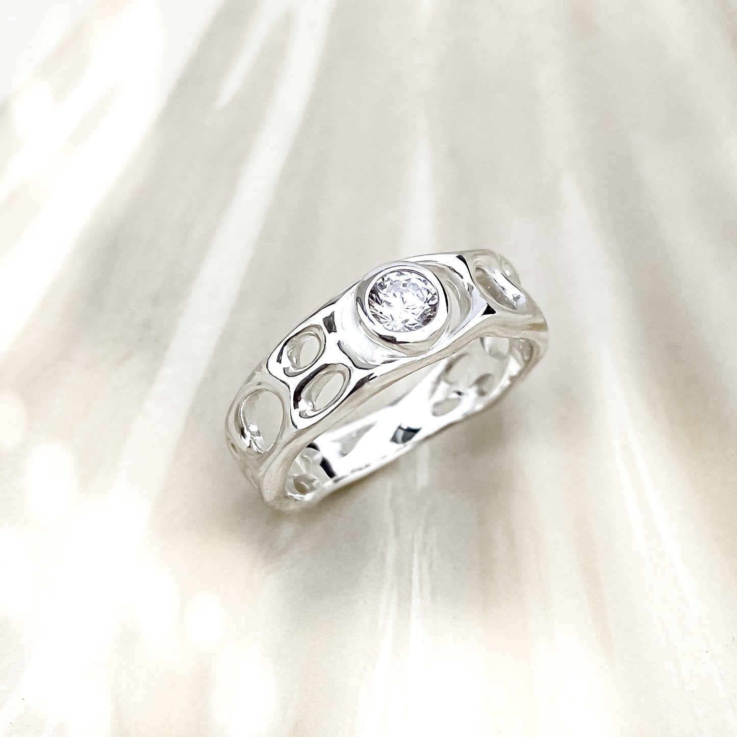 Sterling Silver Infinity Ring with White Topaz